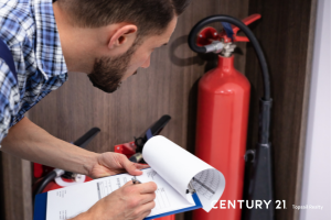 Picture of a fire extinguisher being inspected