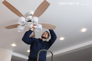Picture of a man working on a ceiling fan